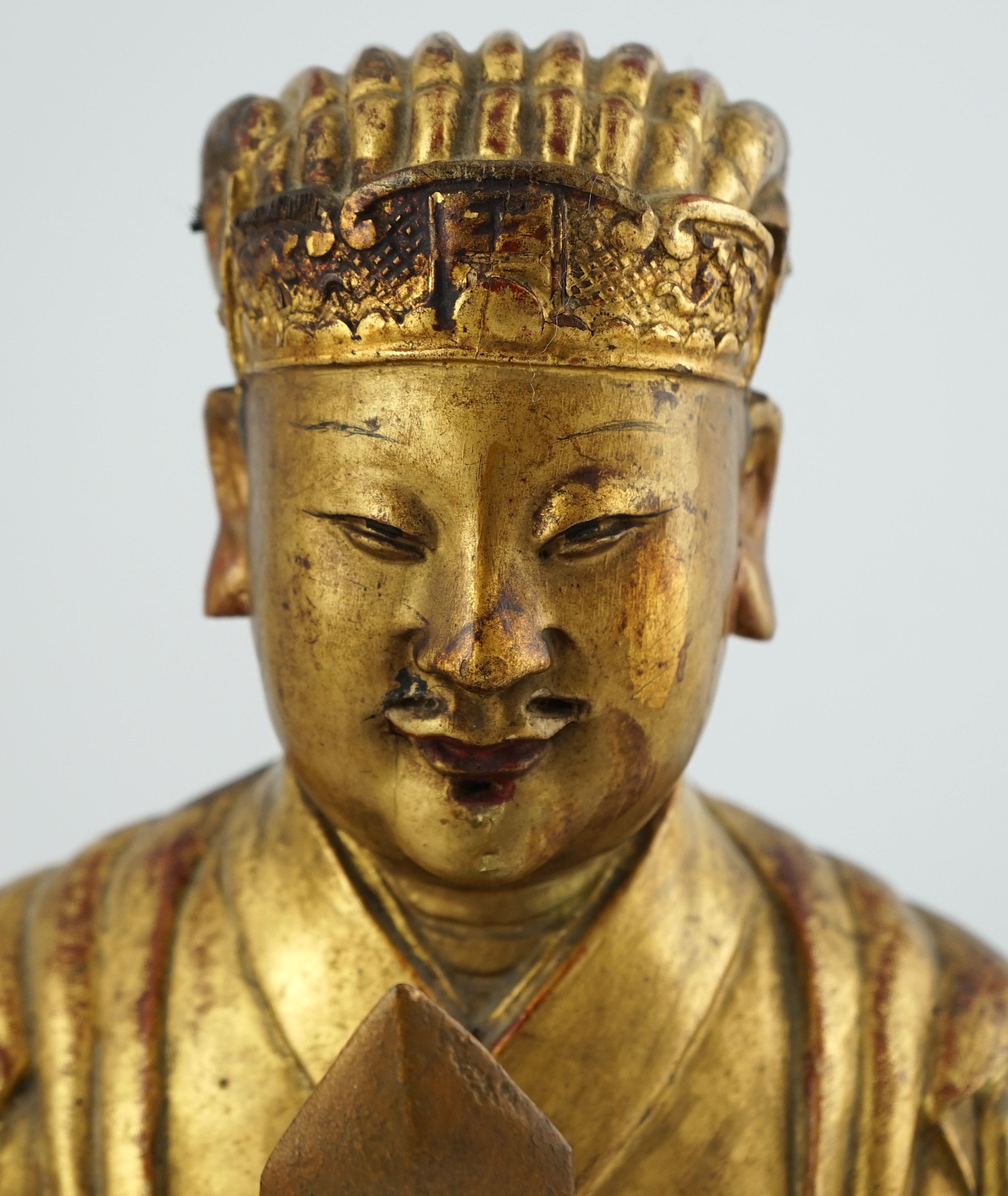 A Chinese gilt lacquered wood seated figure of Wenchang Wang, late Ming, 17th century